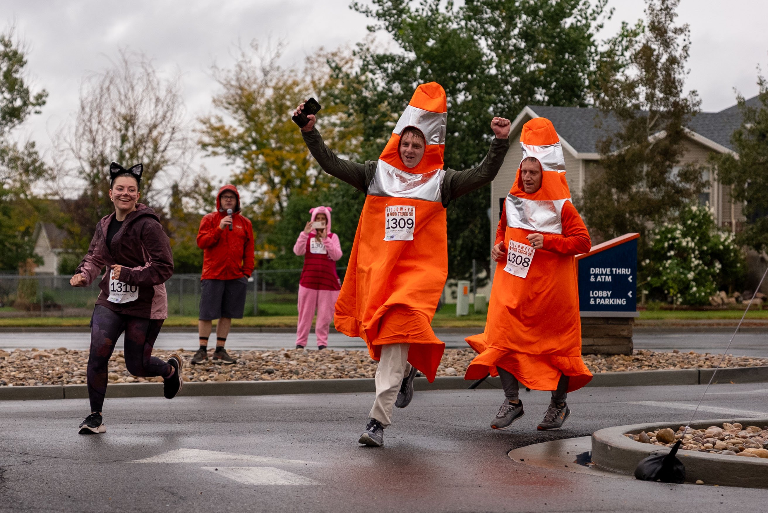 a group of runners running in a costume