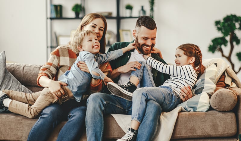 A happy family builds savings with a Flexible Certificate of Deposit.