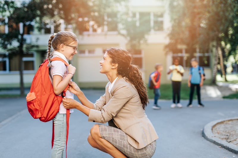 A mother sends her child to a school paid for with an Educational IRA Certificate.