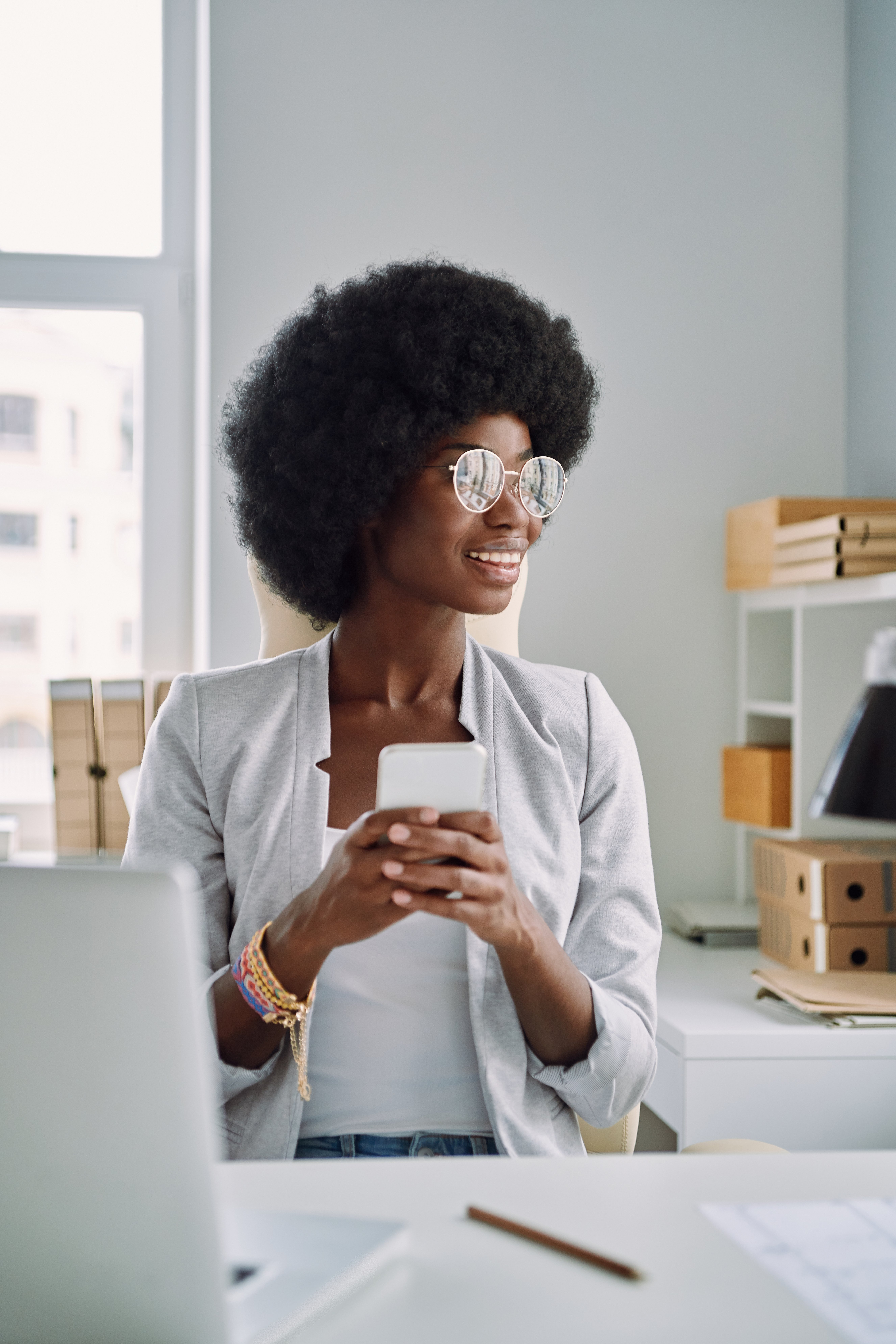 A business owner smiles while opening a business CD account online.