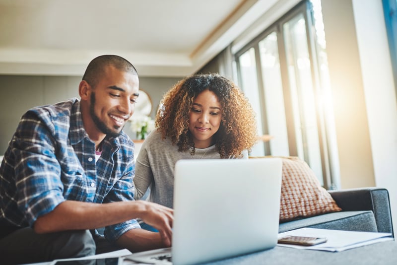 A couple choosing between a Traditional vs. a Roth IRA certificate.