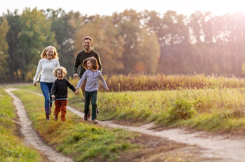 A family enjoys a walk after opening a Roth IRA.