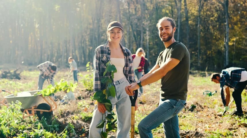 A couple plants trees in an IRA Certificate concept.