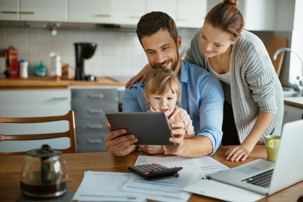 Husband and wife are opening an Educational IRA Account for their daughter so they can start saving early for her education.