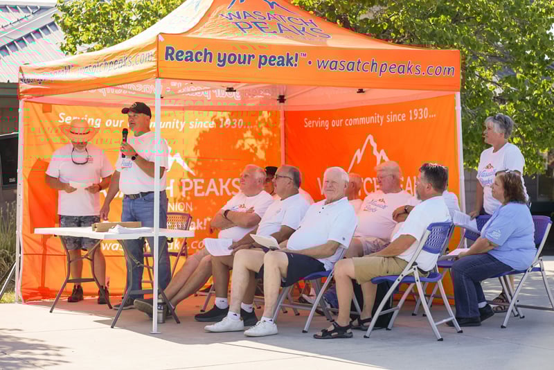 Wasatch Peaks Board of Directors and CEO sitting under tent for Annual Meeting