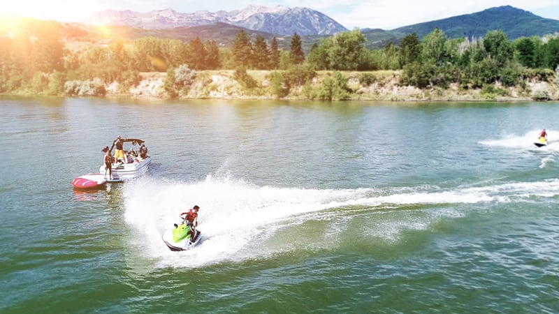 People having fun in boat and wave runners