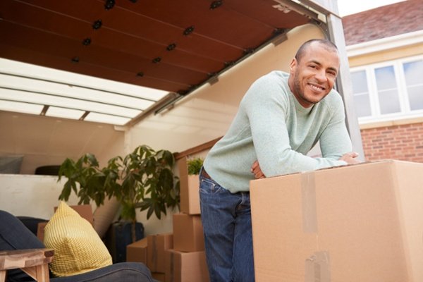 bigstock-Portrait-Of-Man-Unloading-Furn-315592891