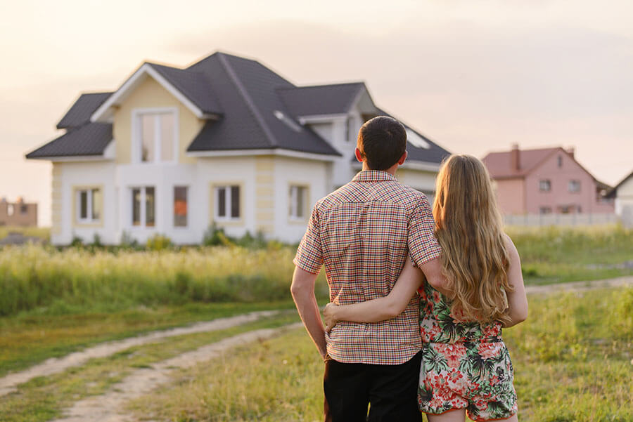 Couple looking at home bought with conventional mortgage loan