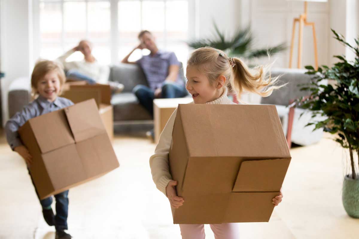 Kids playing with moving boxes