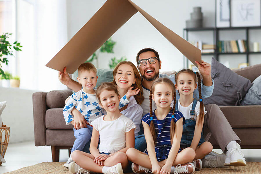 Happy family in their home after refinancing mortgage