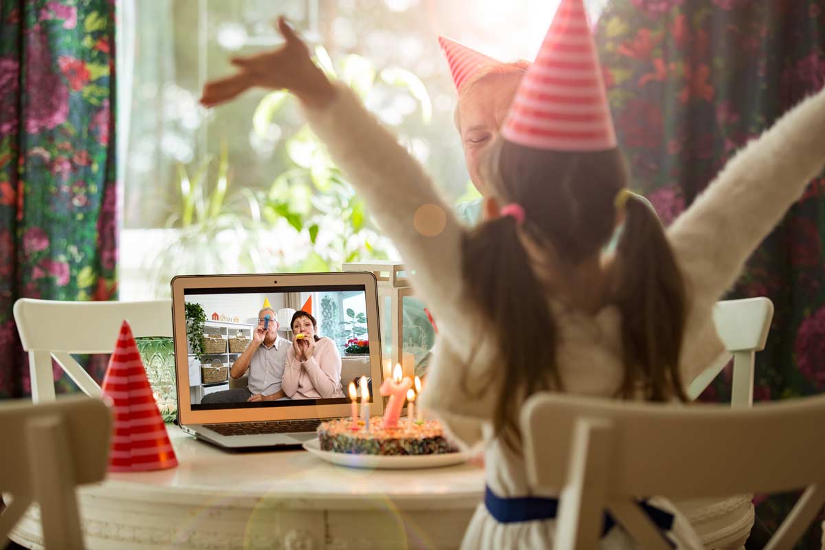 Grandparents celebrating girls birthday over video call
