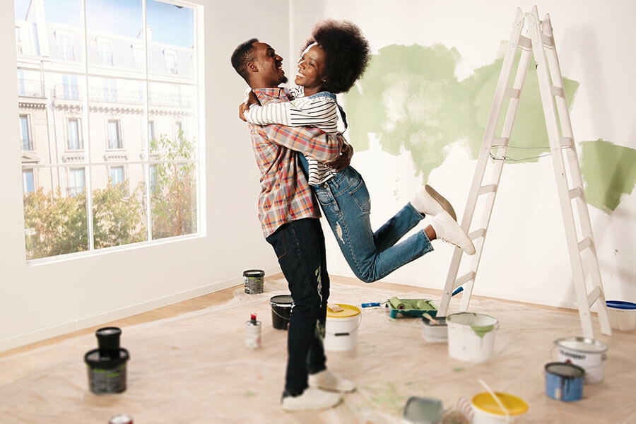A couple makes home improvements after considering a HELOC vs home equity loan.