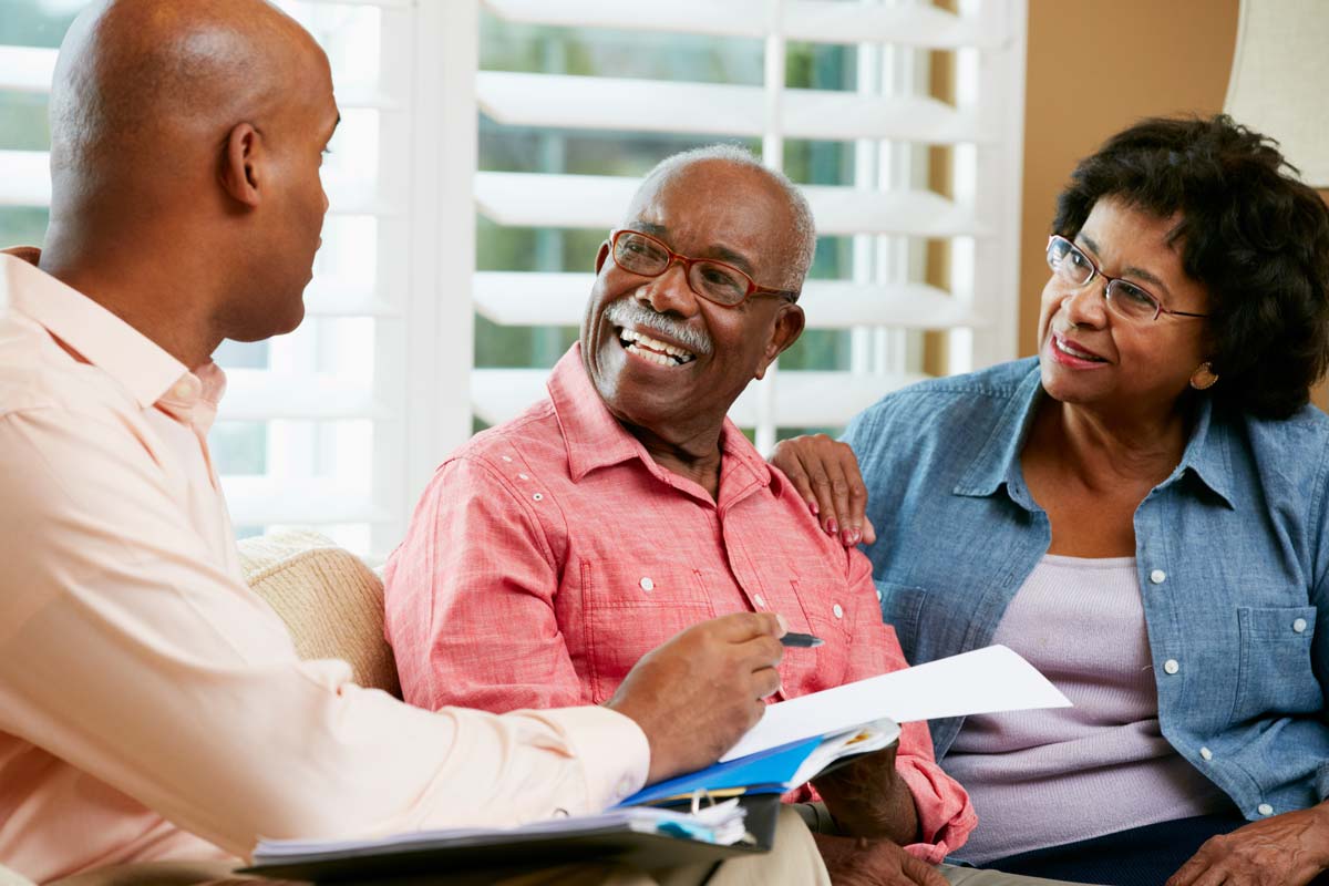 Couple talking to Mortgage Loan Officer