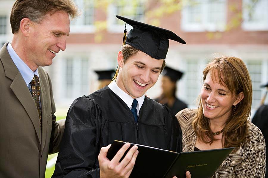 Parents enjoy a child's graduation after using ESA IRA funds.