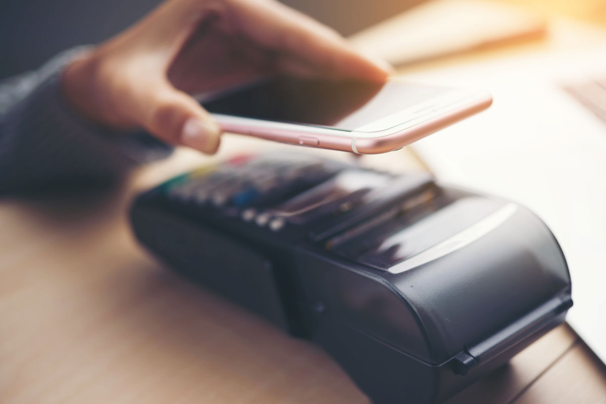 phone being used to pay on card reader