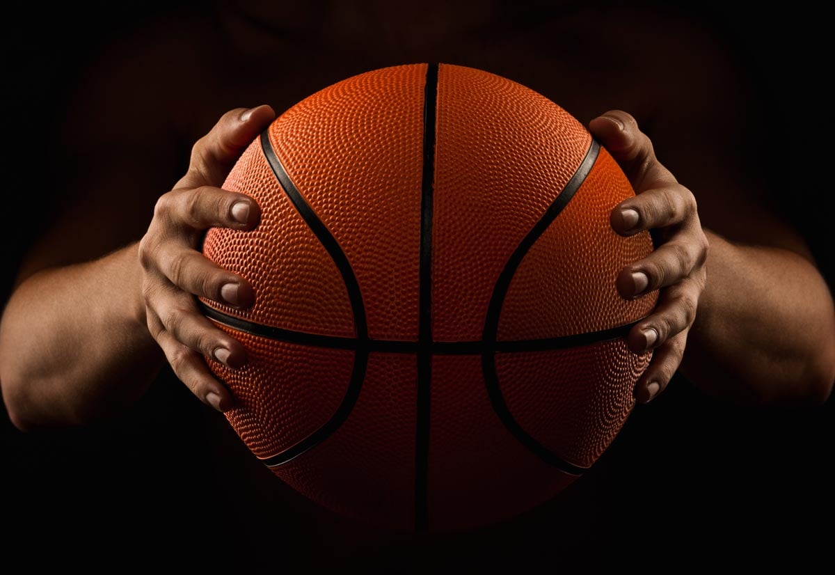 Holding basketball ball