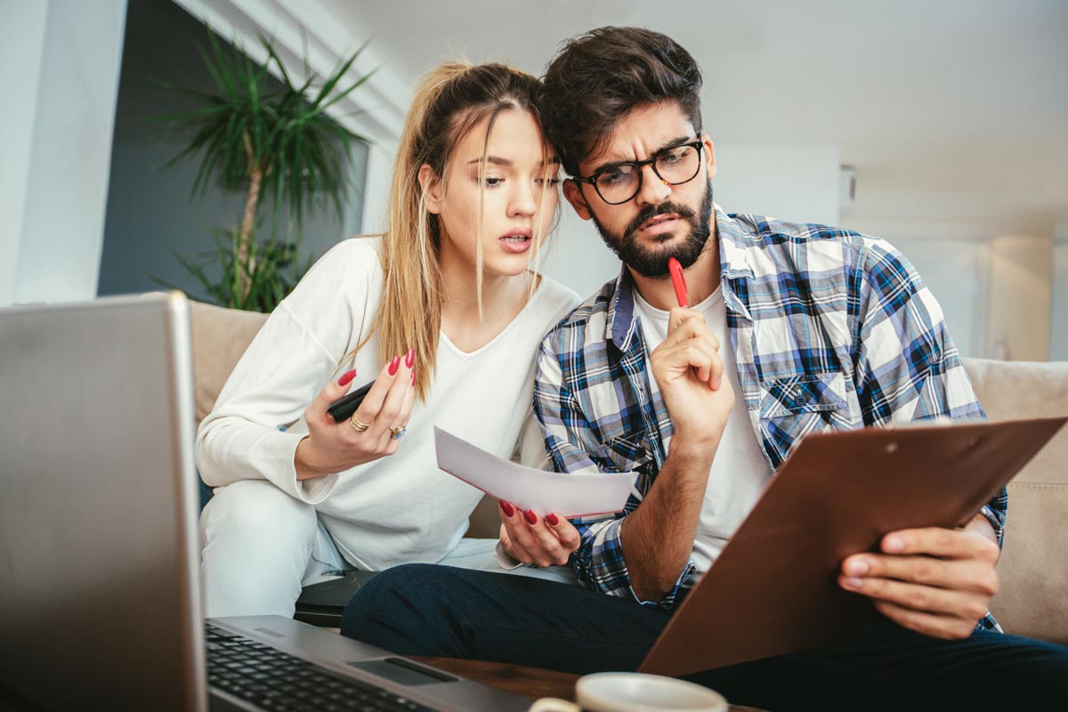 couple looking confused at a document