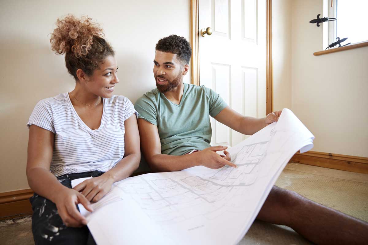 Couple talking about house plans