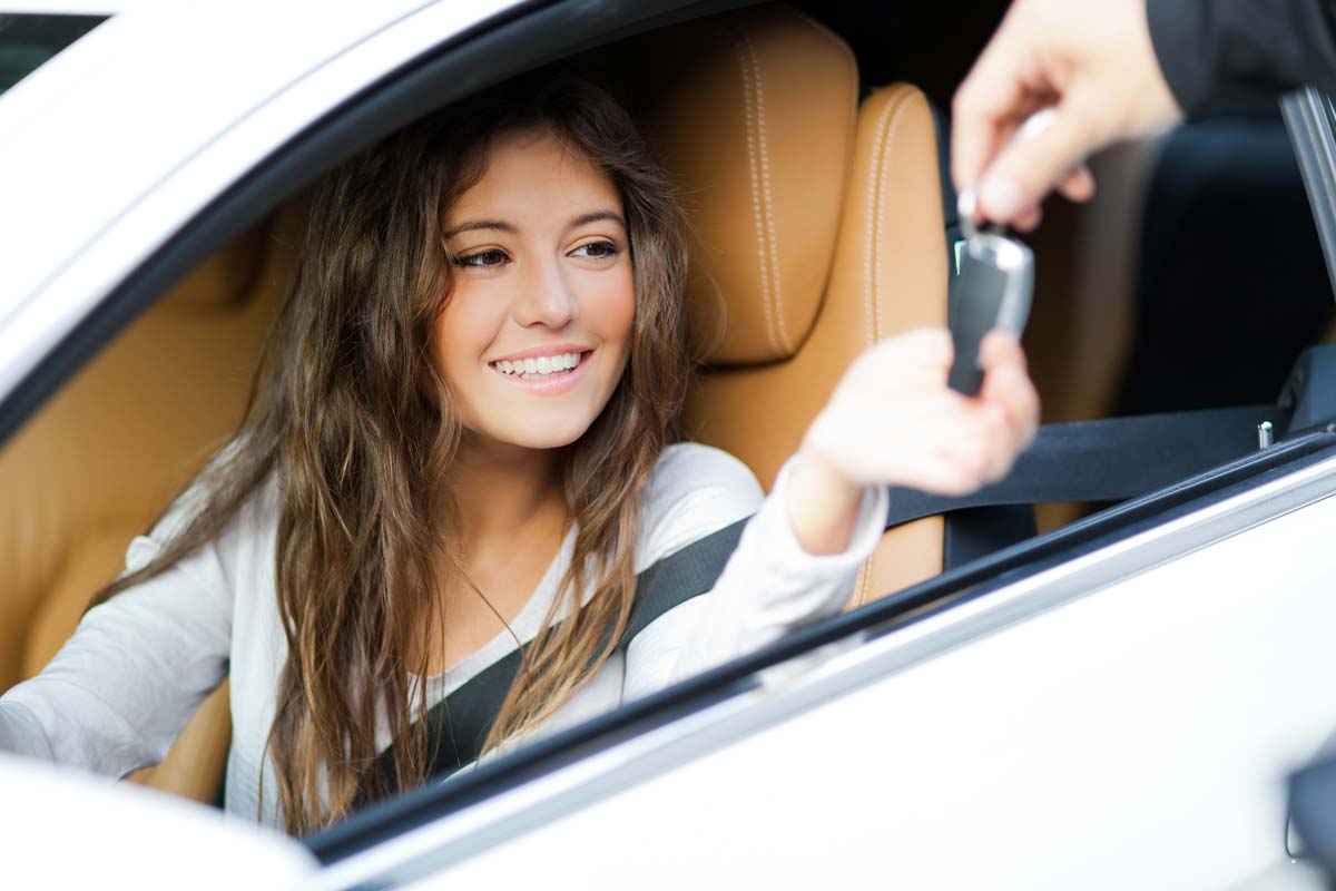 Young woman getting car keys