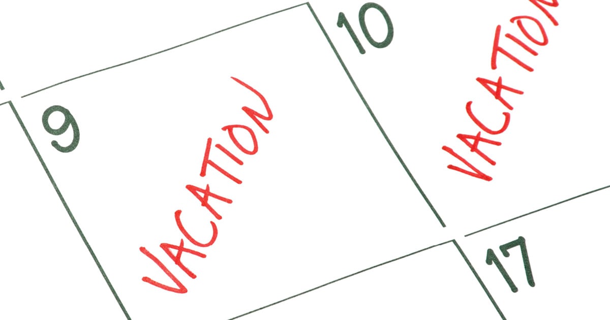 close up image of a calendar with vacation written in the box of dates