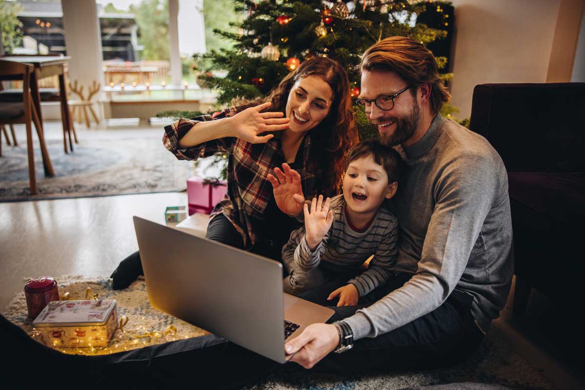 Family video chatting with laptop during Christmas