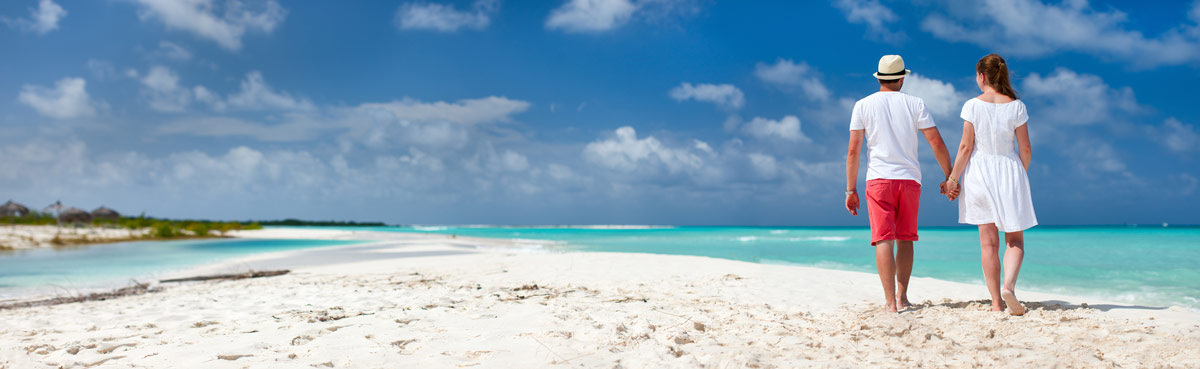 Couple walking along the beach