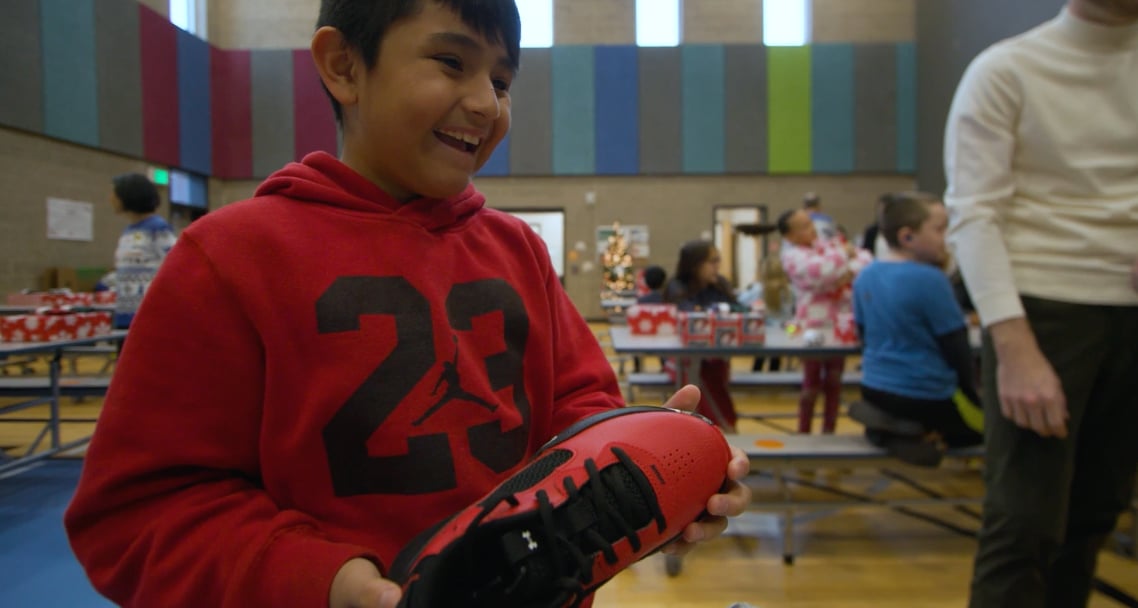 smiling young boy with new shoes