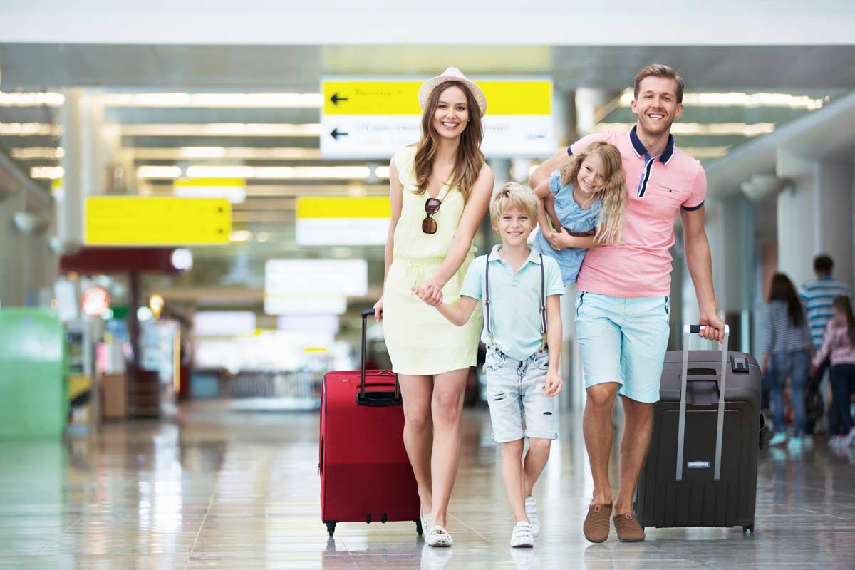 Family walking through the airport