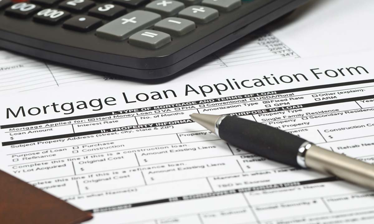 Mortgage Loan Application Form and pen