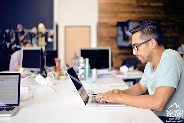 Man typing on laptop