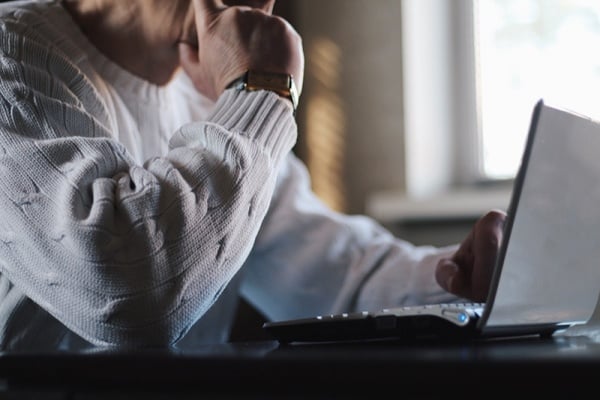 Man typing on laptop computer