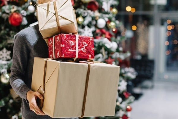 Woman holding lots of presents