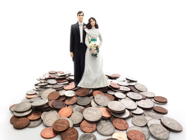 Wedding couple figure on top of coins
