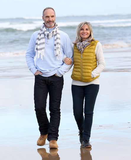 Couple walking along the beach