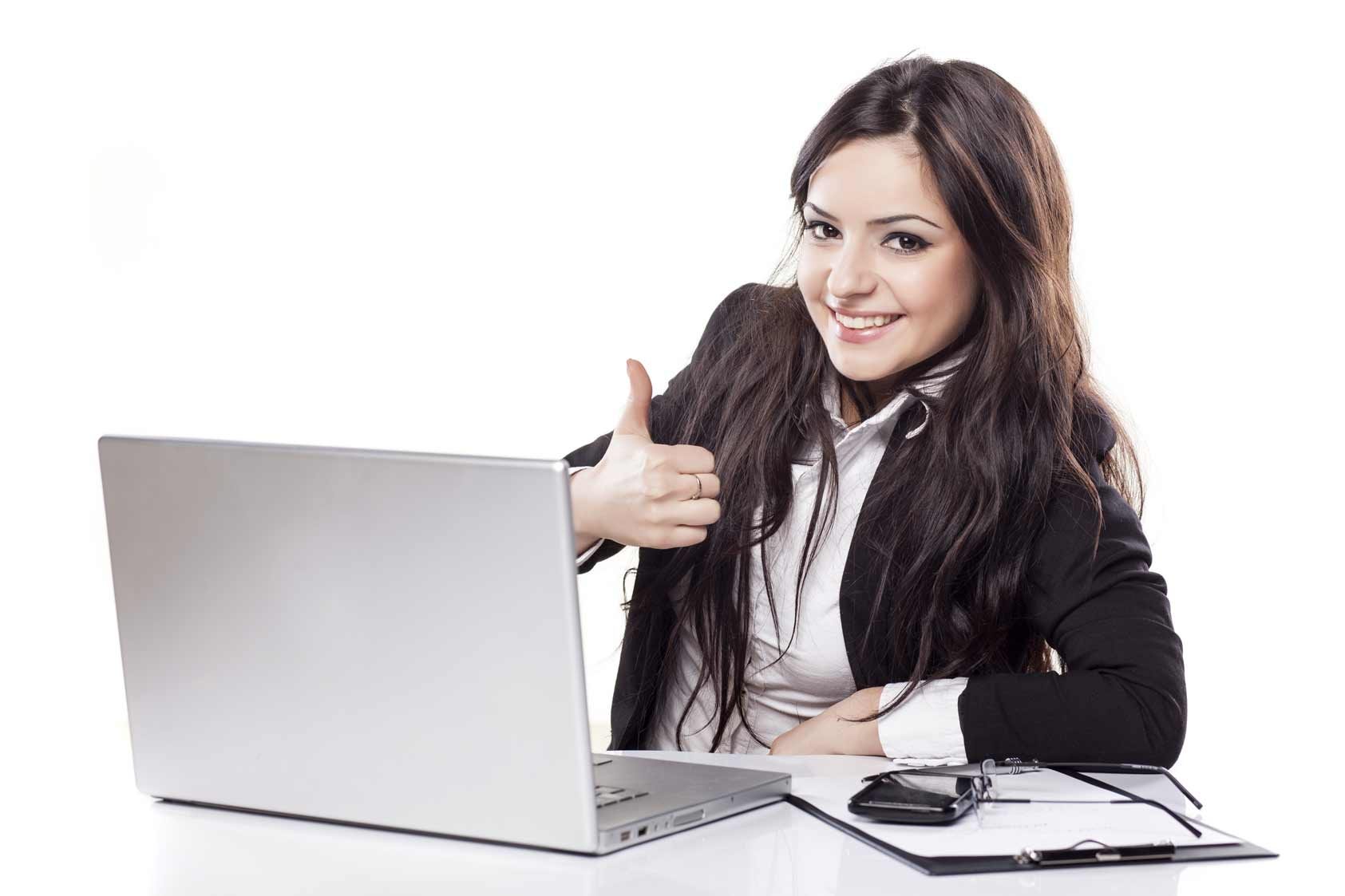 Girl giving thumbs up by laptop