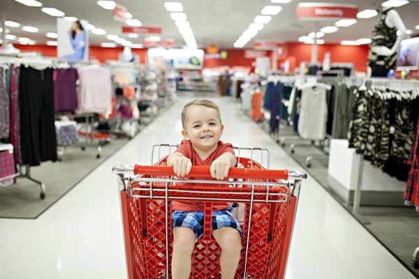 Little boy sitting in a Target shopping cart