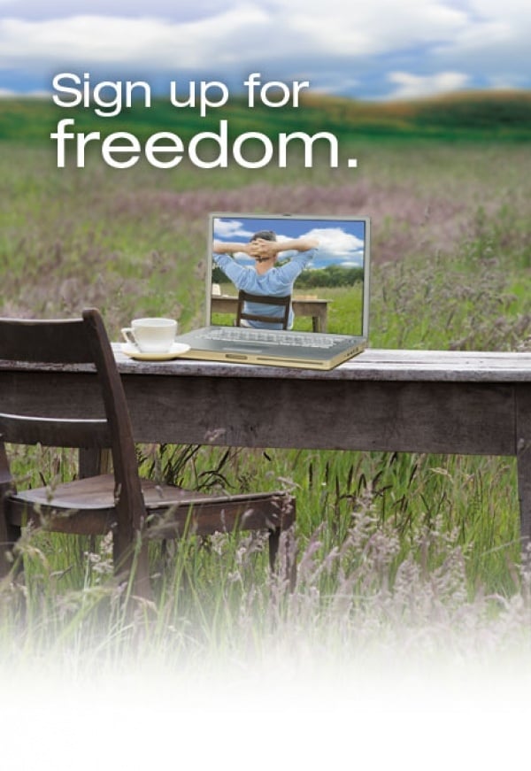 Laptop on desk in the middle of a field