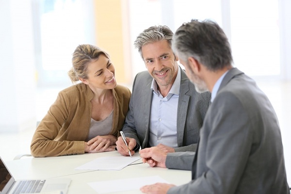 Couple talking to Mortgage Loan Officer