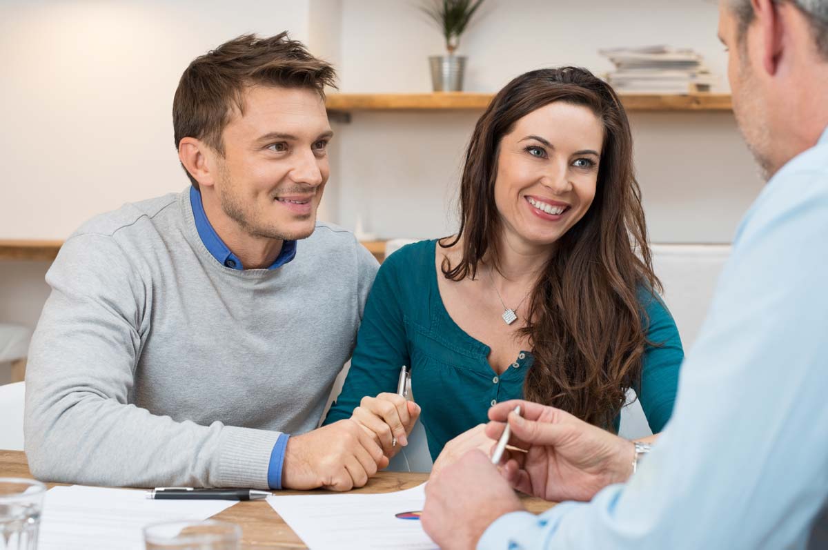 Couple meeting with loan officer to get pre-approved for a loan
