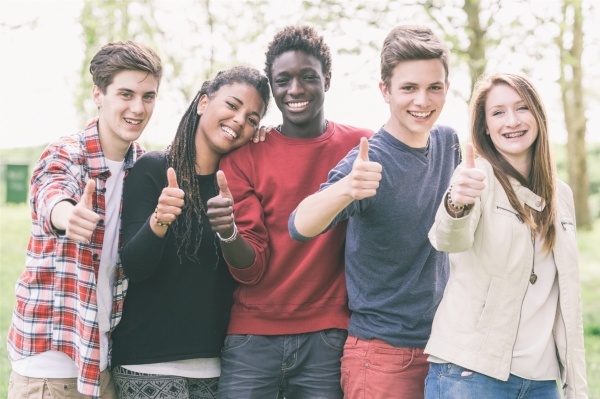 Group of teens giving thumbs up