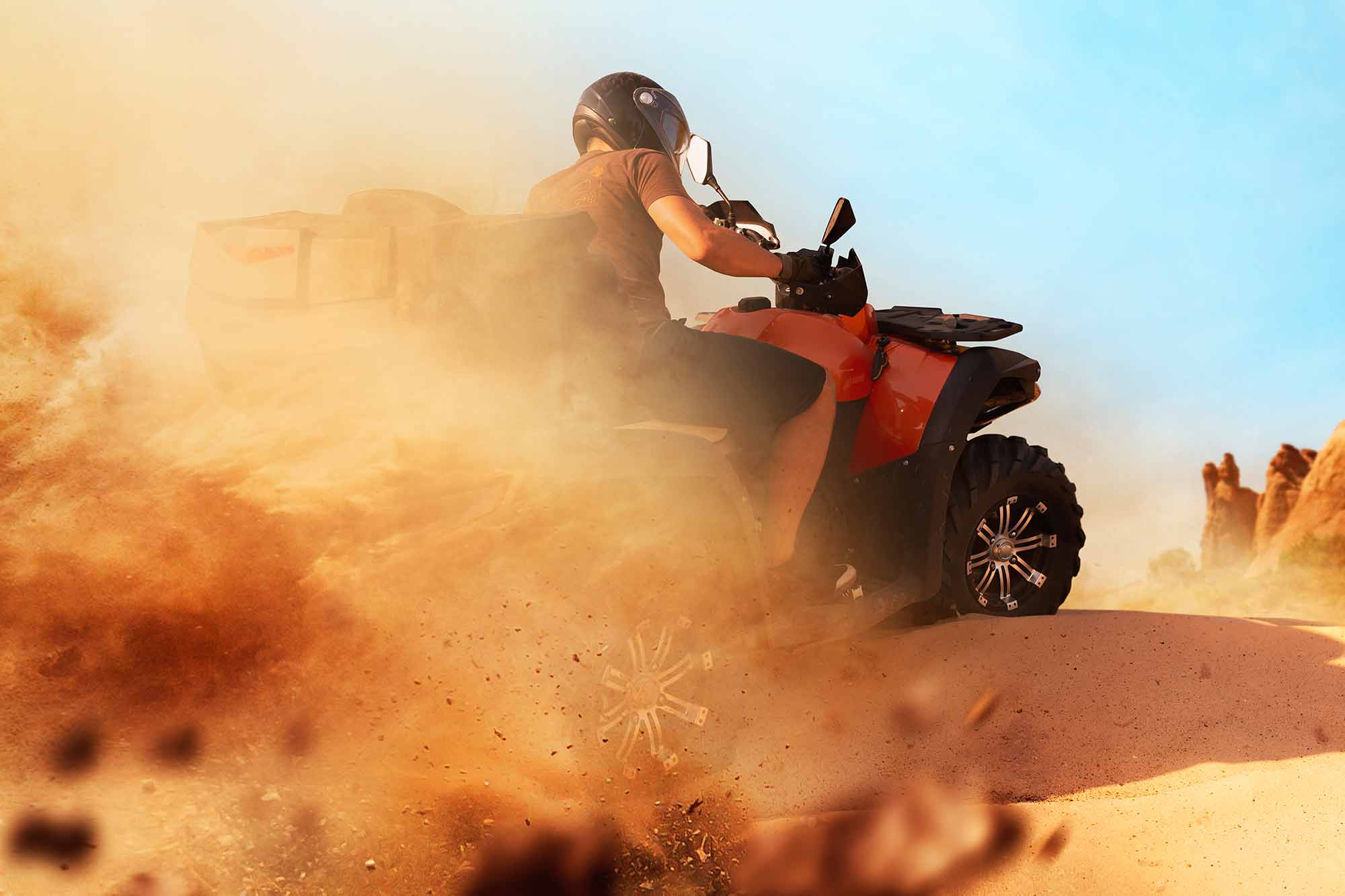 atv-riding-in-sand-quarry-dust-clouds-quad-bike-HKBLRZY