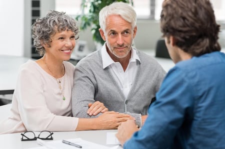 Couple talking to financial advisor