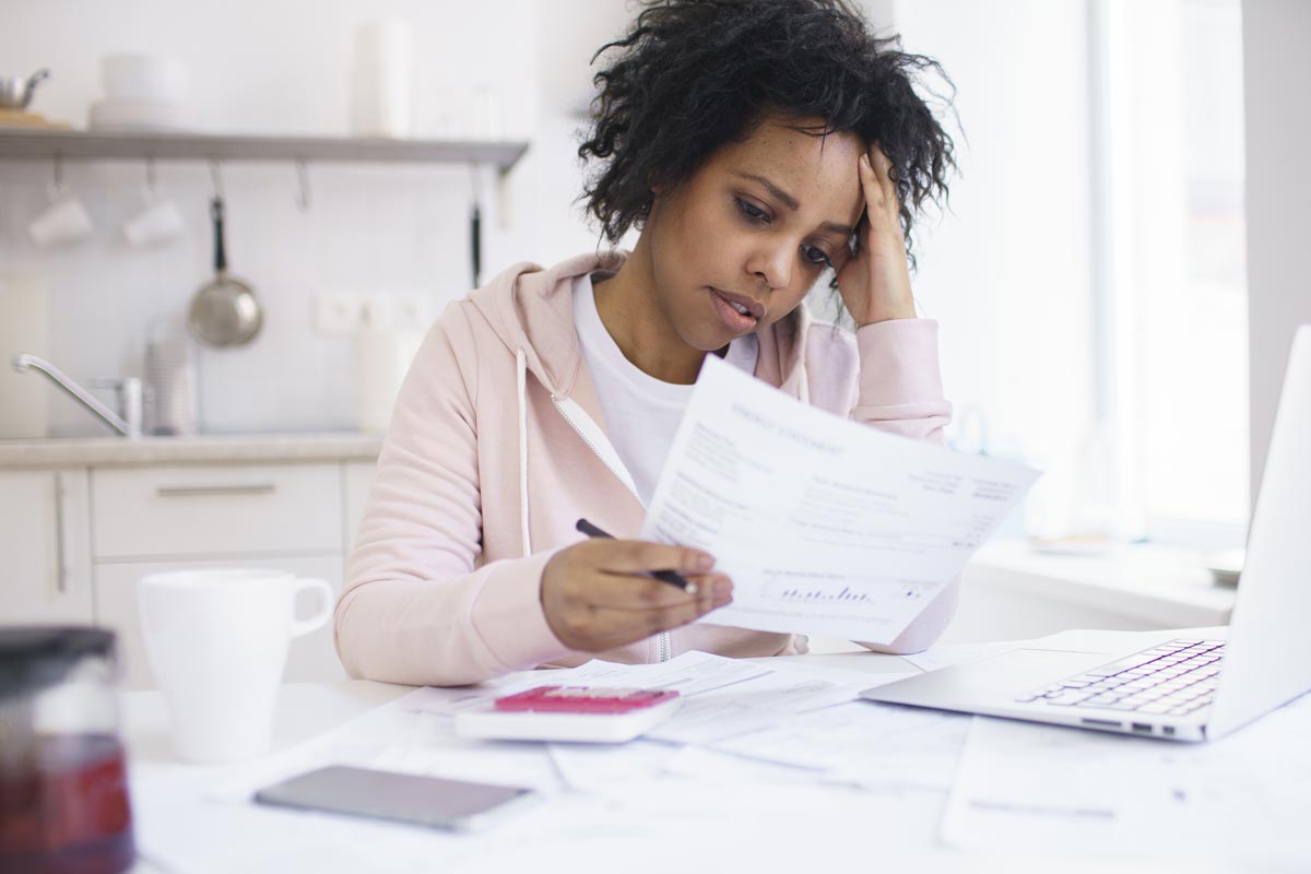 woman looking confused at a paper