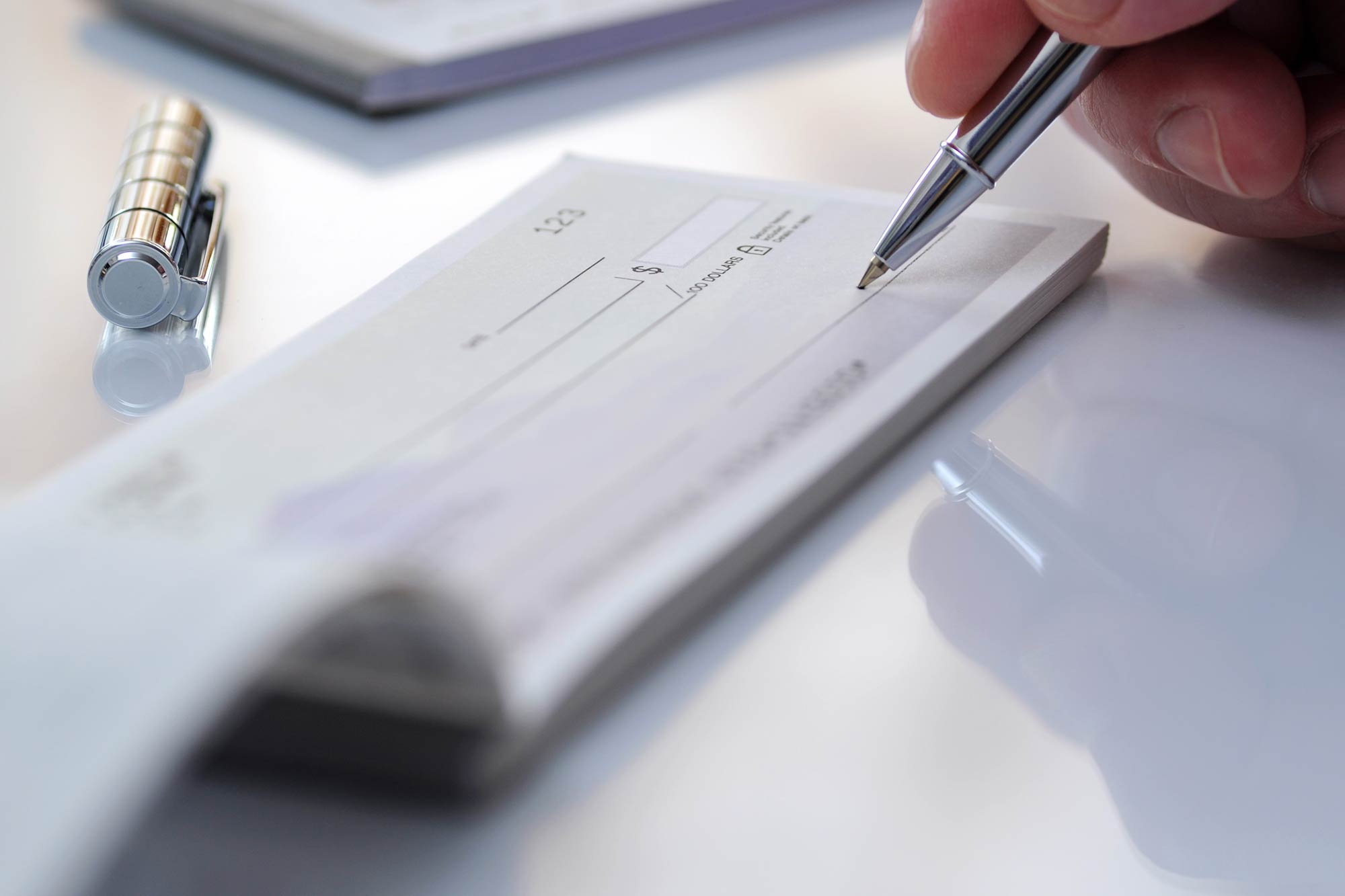 Hand signing a check