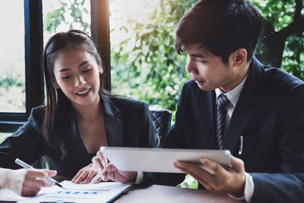 A small business owner discusses small business start-up loans with a credit union representative