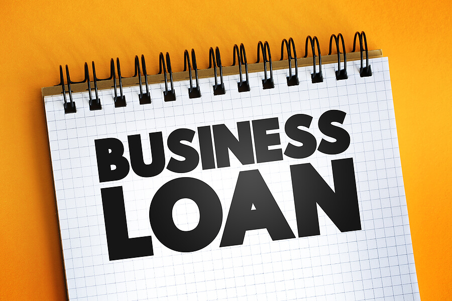 business loan typed in large black letters on a steno pad
