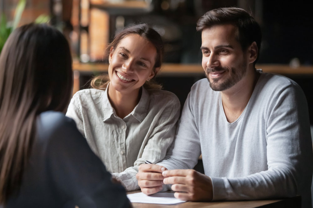 Couple talking to Mortgage Loan officer