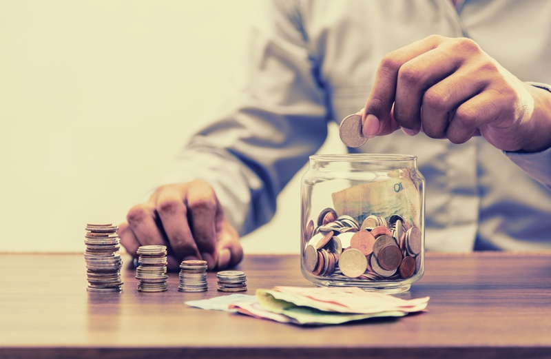 Putting coins into a jar