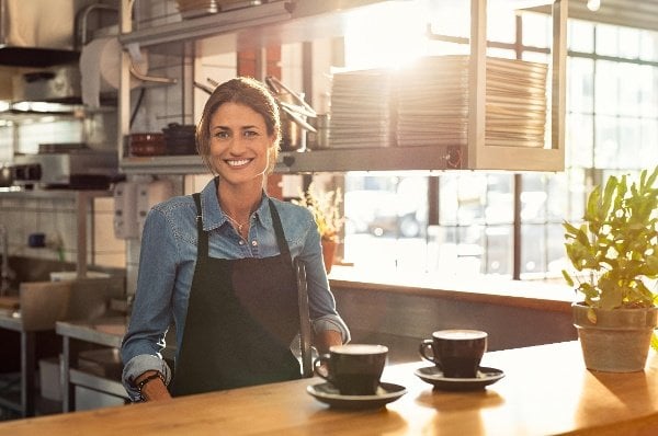 woman serving coffee cups